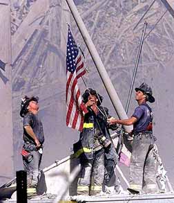firemen raising flag