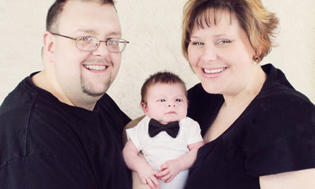 Baby Connor Levy with his parents David Levy and Marybeth Scheidts.