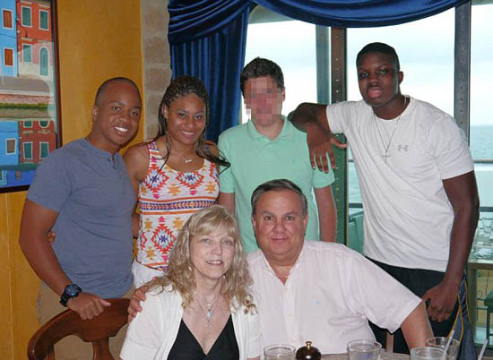 Robert and Theresa Gallo (front) with Teia (second from left) and Travis (right).