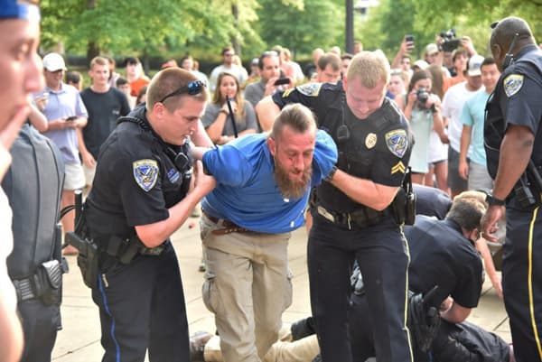 An alt-right supporter was arrested at Auburn after a scuffle with antifa.