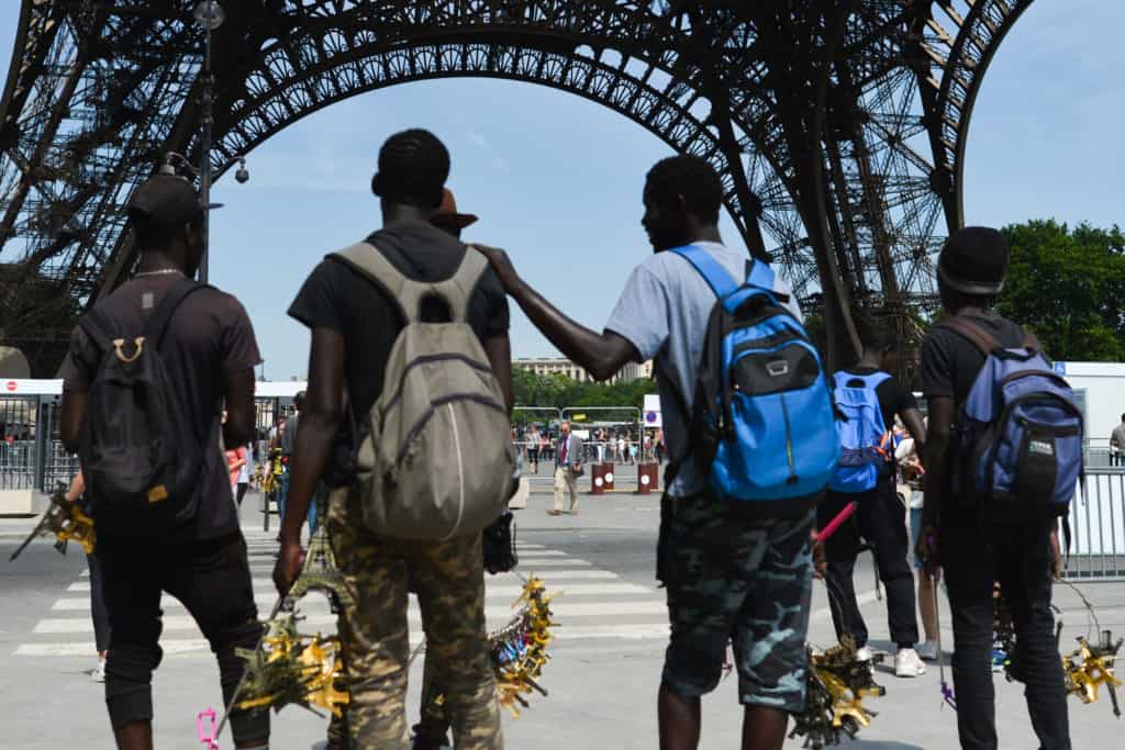 Black Africans at the Eiffel Tower in Paris, France