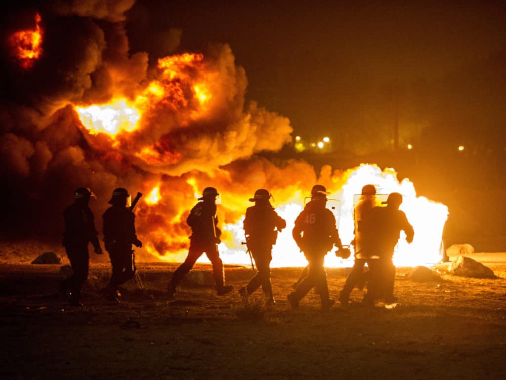 Clashes as French Clear Calais Jungle Migrant Camp
