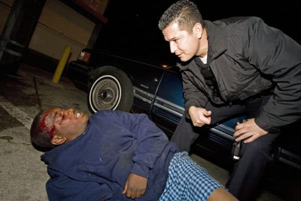 Cop with Dying Black Gangster