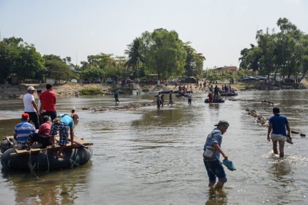 Hondurans cross the Suchiate River
