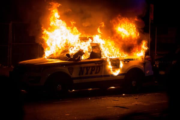 A SUV of New York police department burns
