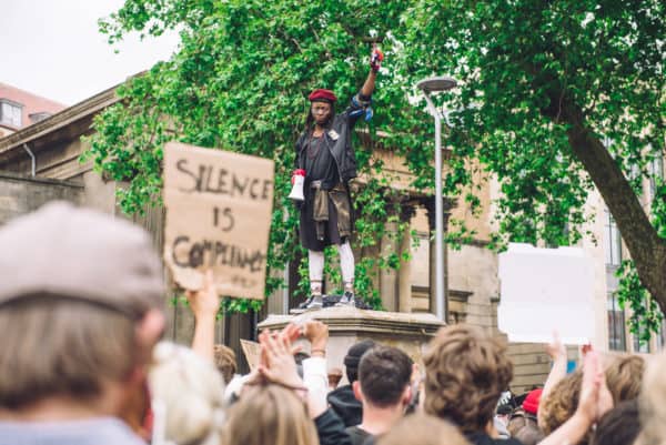 Protester speaks to a crowd from the pedestal that once hosted the statue of Edward Colston