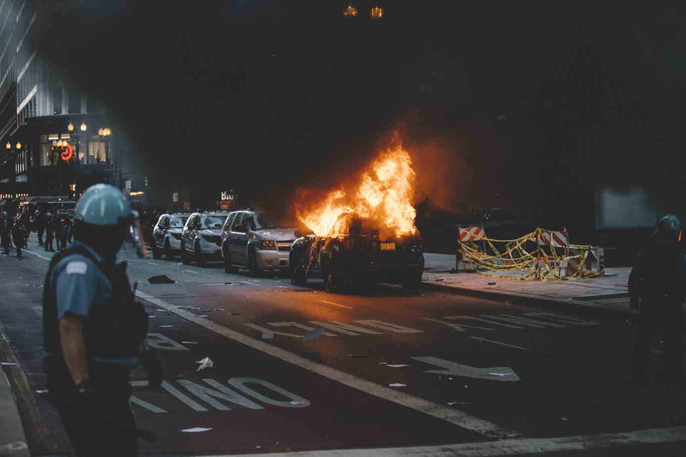 Protesters destroy police vehicles