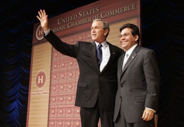 President George W. Bush waves next to Attorney General Alberto Gonzales after speaking to the Hispanic Chamber of Commerce, at the Ronald Reagan Building in Washington, D.C., April 20, 2005. (Credit Image: © Chuck Kennedy / TNS / ZUMAPRESS.com)