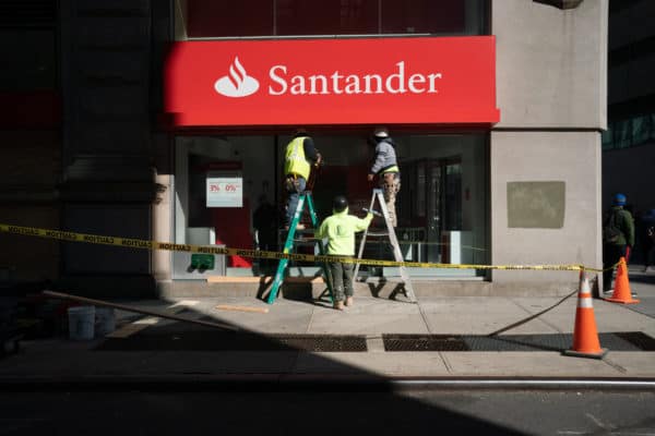 Workers board up a bank in NYC ahead of Election Day