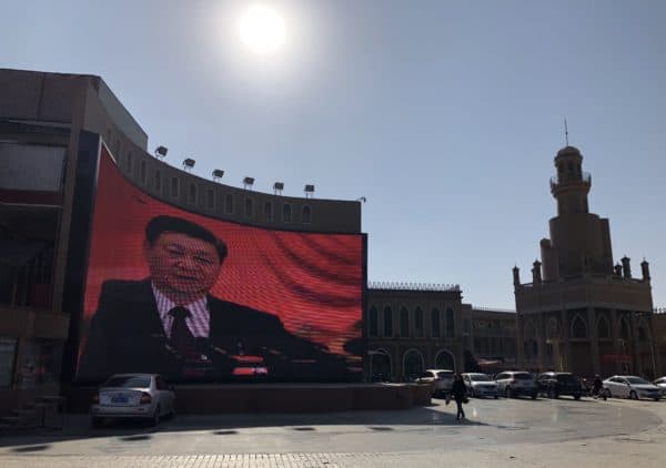 Xi Jinping, President of China, can be seen on a video wall in the western Chinese city of Kashgar. Strict security measures are in place in the oasis city, making reporting difficult for journalists and affecting the lives of Uighur minorities. (Credit Image: © Simina Mistrenau / DPA via ZUMA Press)