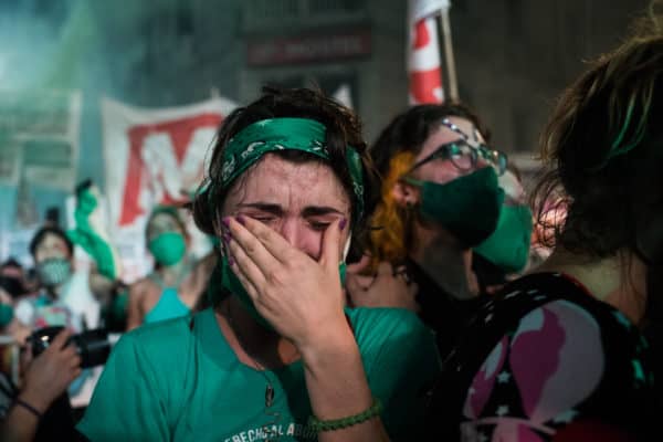 A woman cries after the approval of the legalization and decriminalization of abortion in Argentina, in Buenos Aires, Argentina, on December 30, 2020. (Credit Image: © Matias Chiofalo/Contacto via ZUMA Press)