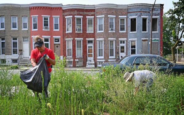 Whites Picking Up Trash in Baltimore