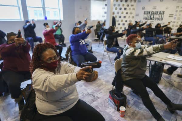 Black Women Training with Guns