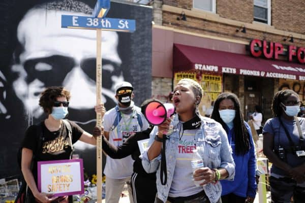 Women rally in front of a large portrait of George Floyd in front of Cup Foods in Minneapolis (Credit Image: © Jack Kurtz / ZUMA Wire)