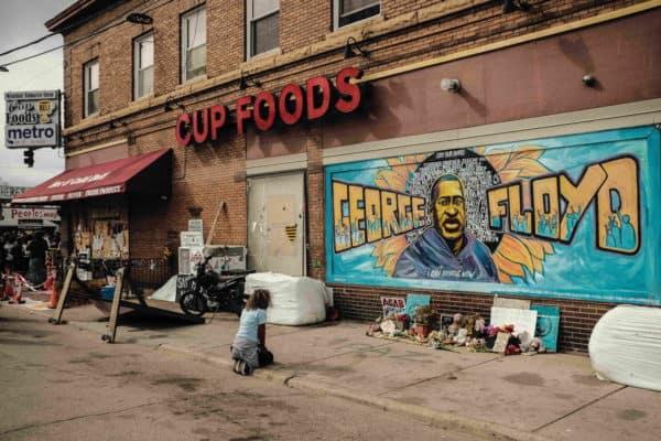 Kneeling at the George Floyd Mural