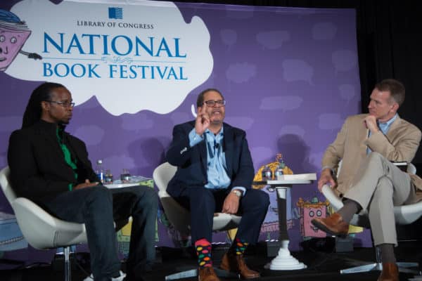 Ibram X. Kendi (left) and Michael Eric Dyson (center) participate in a conversation on ”Race in America” moderated by Steve Inskeep of National Public Radio. (Credit Image: © Jeff Malet/Newscom via ZUMA Press)