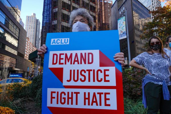 November 7, 2020, New York, United States: A woman wearing a face mask holds a placardduring the celebration of Biden’s win. (Credit Image: © John Nacion / SOPA Images via ZUMA Wire)