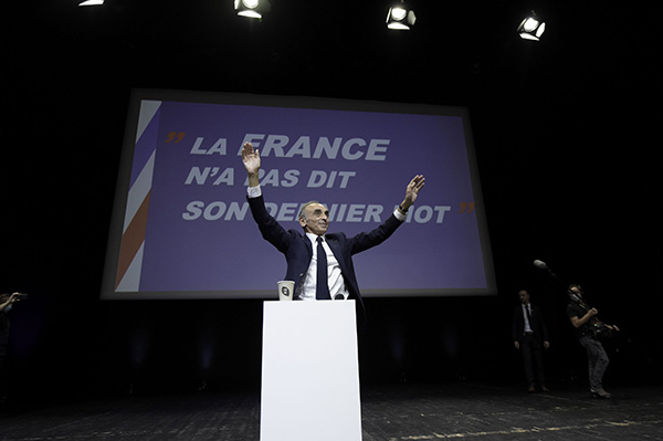 Eric Zemmour on stage with the title of his book behind him. (Credit Image: © Laurent Coust/SOPA Images via ZUMA Press Wire)