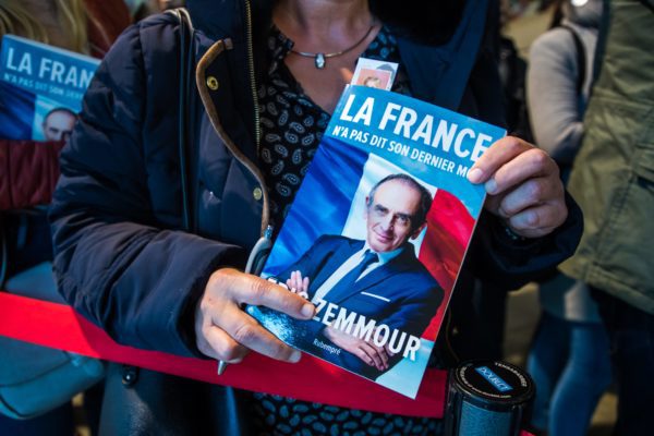 A supporter of Eric Zemmour waits for a signature after a meeting at the Zenith venue in Rouen, north western France, on October 22, 2021. (Credit Image: © Maxppp via ZUMA Press)