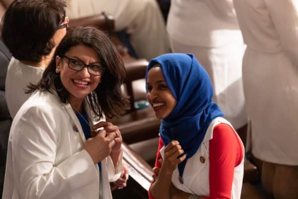 Rep. Rashida Tlaib (D-MI), and Rep. Ilhan Omar (D-MN), talk before U.S. President Donald Trump’s second State of the Union address to a joint session of Congress at the U.S. Capitol in Washington, D.C., on Tuesday, Feb. 5, 2019. (Credit Image: © Cheriss May / NurPhoto via ZUMA Press)